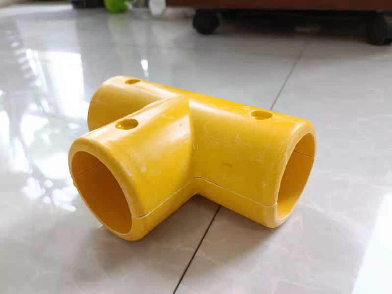A 3-way 90 degree FRP handrail fitting